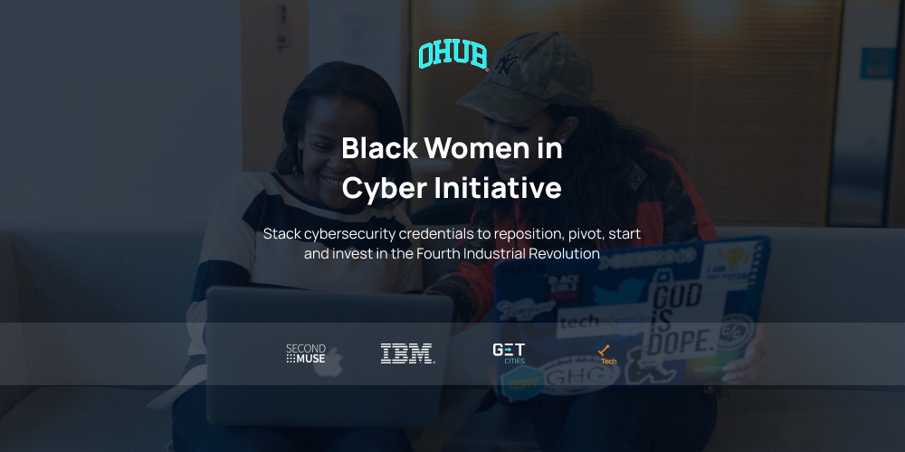 Black women in cyber initiative with two women on laptops in the background.