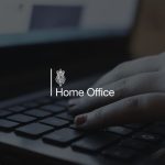 woman typing on a laptop, with the Home Office logo overlayed